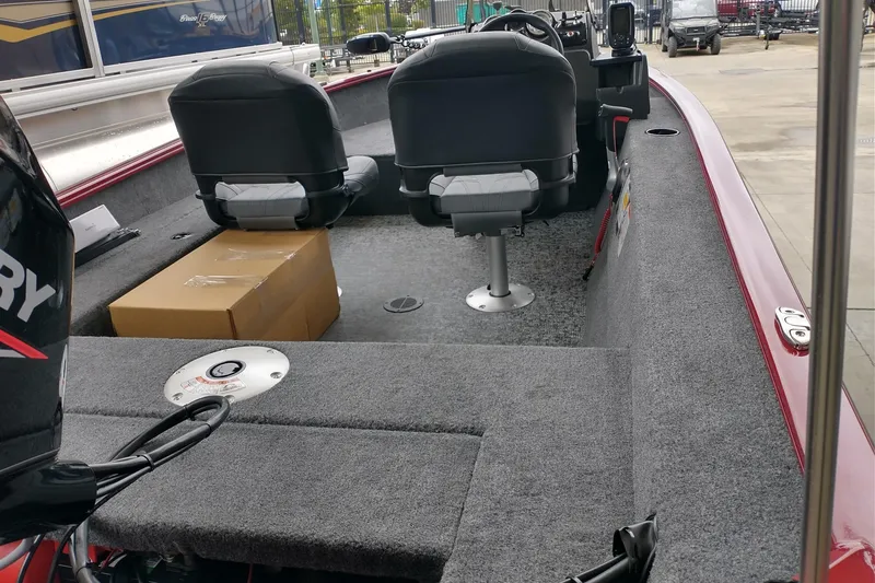 Slide: The Image of Interior of 2026 Tracker Super Guide V-16 SC boat with seating and equipment. - 4