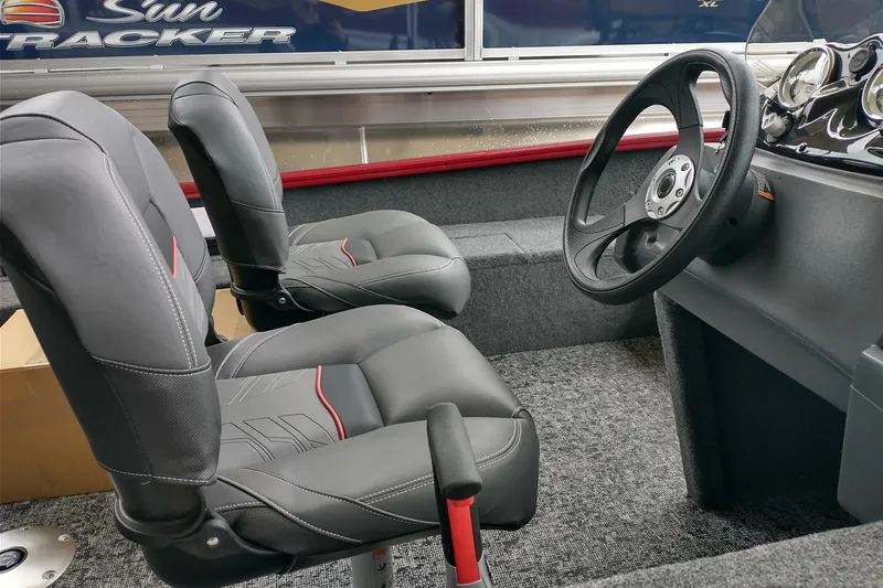 Slide: The Image of Interior of 2026 Tracker Super Guide V-16 SC boat with steering wheel and seats. - 5