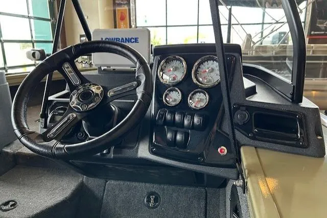Slide: The Image of 2026 Tracker Targa V-19 Combo dashboard with steering wheel and instrument panel. - 2