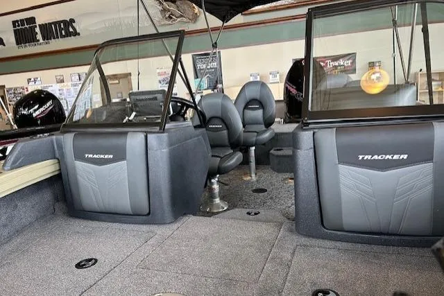 Slide: The Image of 2026 Tracker Targa V-19 Combo boat interior with seating and dashboard view. - 4