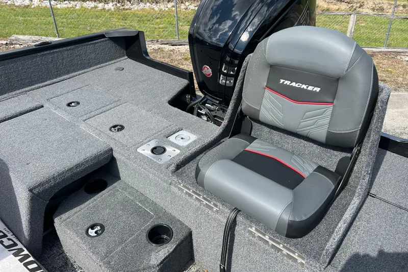 Slide: The Image of 2026 Tracker Pro Guide V-175 Combo boat interior with cushioned seating and storage compartments. - 10