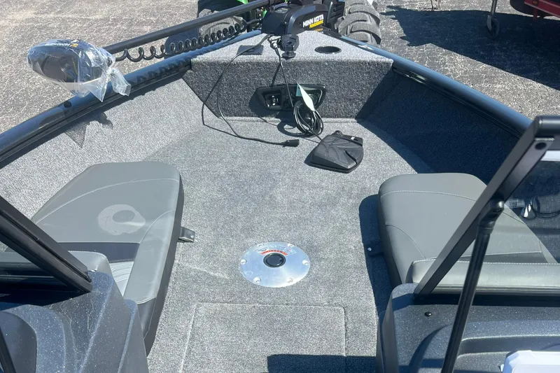 Slide: The Image of 2026 Tracker Pro Guide V-175 Combo boat interior with seating and trolling motor. - 2