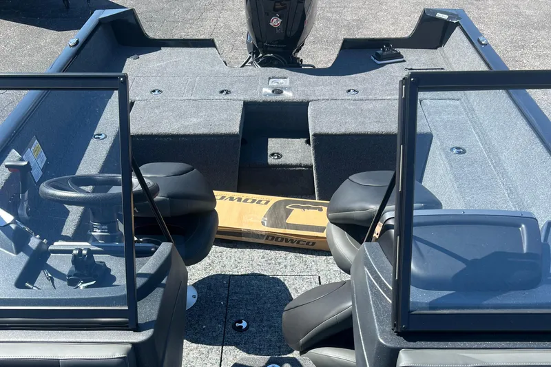 Slide: The Image of 2026 Tracker Pro Guide V-175 Combo boat interior with seating and steering wheel. - 4