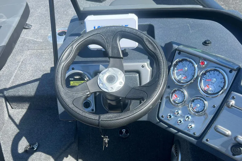 Slide: The Image of Steering wheel and dashboard of 2026 Tracker Pro Guide V-175 Combo boat. - 7