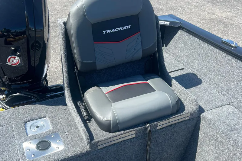 Slide: The Image of 2026 Tracker Pro Guide V-175 Combo boat seat with motor, featuring gray upholstery. - 8