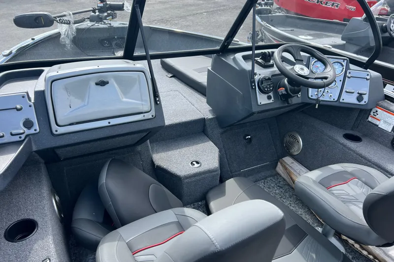 Slide: The Image of 2026 Tracker Pro Guide V-175 Combo boat interior with steering console and seating. - 9