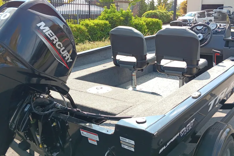 Slide: The Image of 2026 Tracker Super Guide V-16 SC boat with Mercury engine, featuring dual seats and steering console. - 3