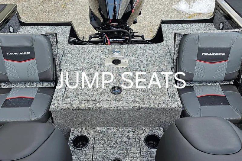 Slide: The Image of 2026 Tracker Targa V-19 Combo boat interior with seating and carpeted deck. - 11