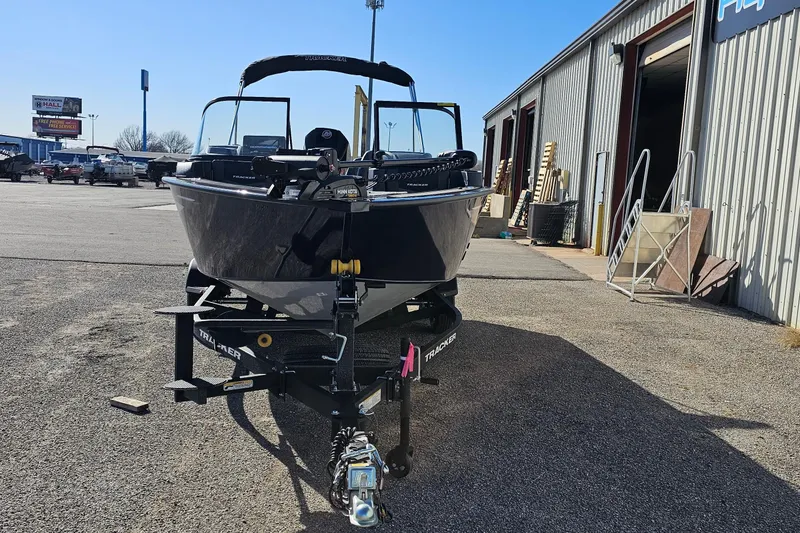 Slide: The Image of 2026 Tracker Targa V-19 Combo boat on trailer, side view, beige color. - 2