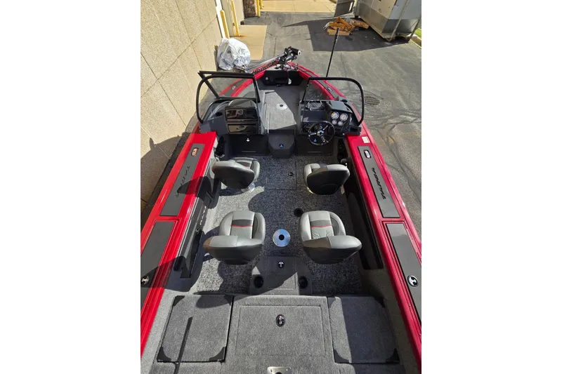 Slide: The Image of 2026 Tracker Targa V-19 Combo boat interior with red accents and four seats. - 4