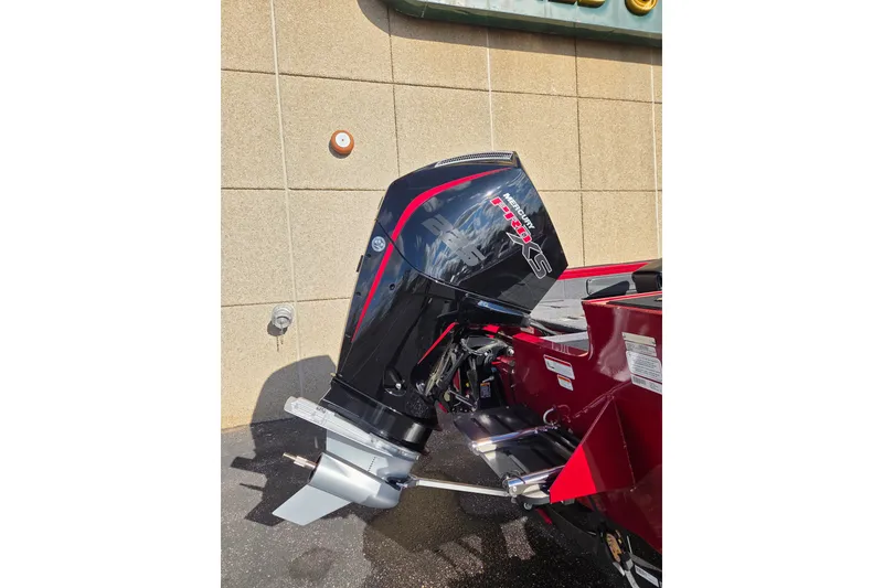 Slide: The Image of 2026 Tracker Targa V-19 Combo boat with Mercury outboard motor, red and black design. - 7