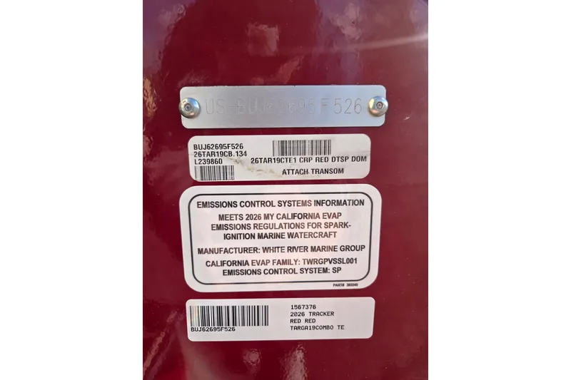 Slide: The Image of 2026 Tracker Targa V-19 Combo emissions control label on red transom. - 9