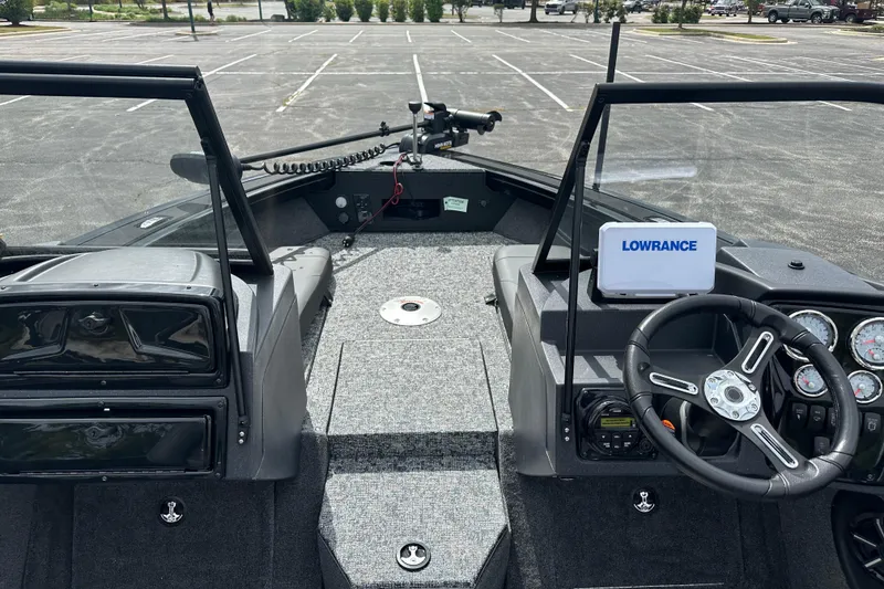 Slide: The Image of 2026 Tracker Targa V-19 Combo boat interior with steering wheel and Lowrance display. - 5