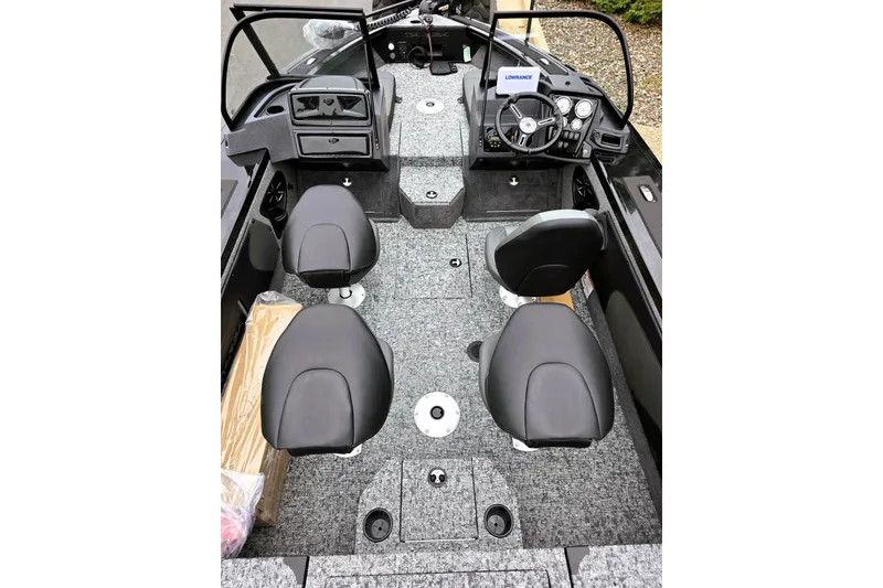 Slide: The Image of 2026 Tracker Targa V-19 Combo boat interior with four seats and steering console. - 6