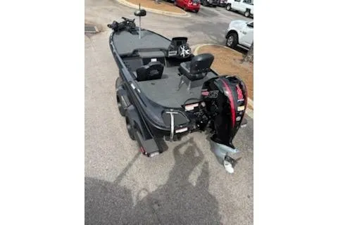 Slide: The Image of 2026 Nitro Z18 Pro boat interior with seating and display signs in showroom. - 2