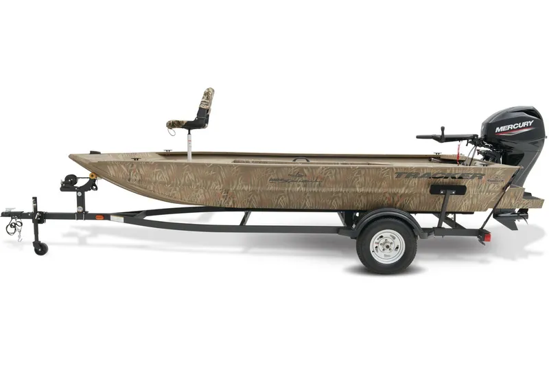 Slide: The Image of 2026 Tracker Grizzly 1654 T Sportsman boat with camouflage design on a parking lot. - 2