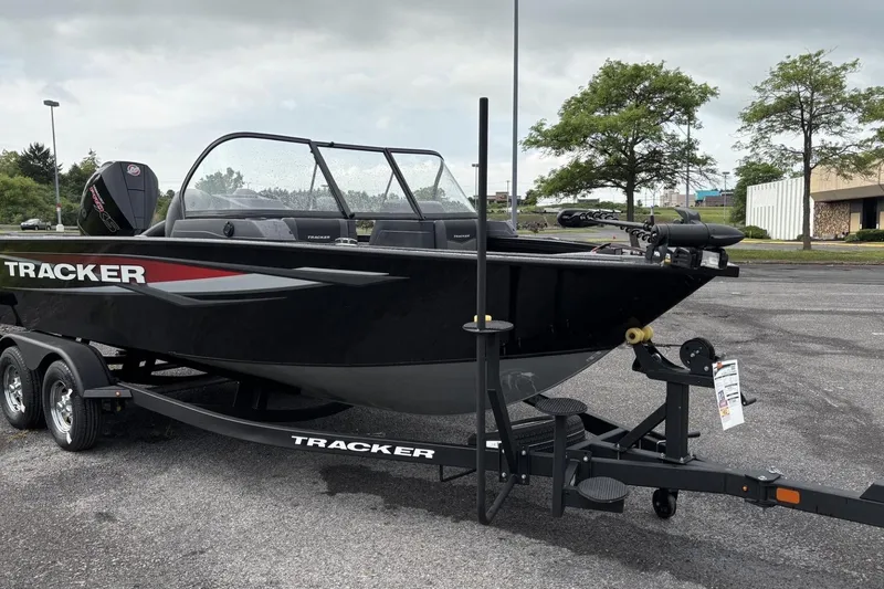 The Image of 2026 Tracker Targa V-19 Combo boat on trailer in parking lot. - 0