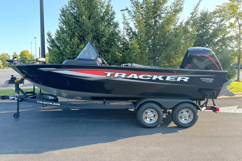 The Image of 2026 Tracker Targa V-19 Combo boat on trailer, parked outdoors. - 0