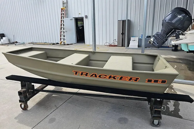 The Image of 2026 Tracker Grizzly 10 Jon boat on display in a marina setting. - 1