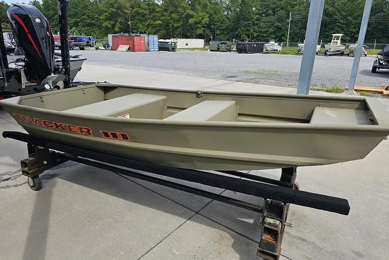 Slide: The Image of 2026 Tracker Grizzly 10 Jon boat on trailer, displayed outdoors. - 3