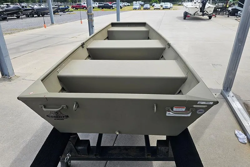 Slide: The Image of 2026 Tracker Grizzly 10 Jon boat on display at a dealership. - 4