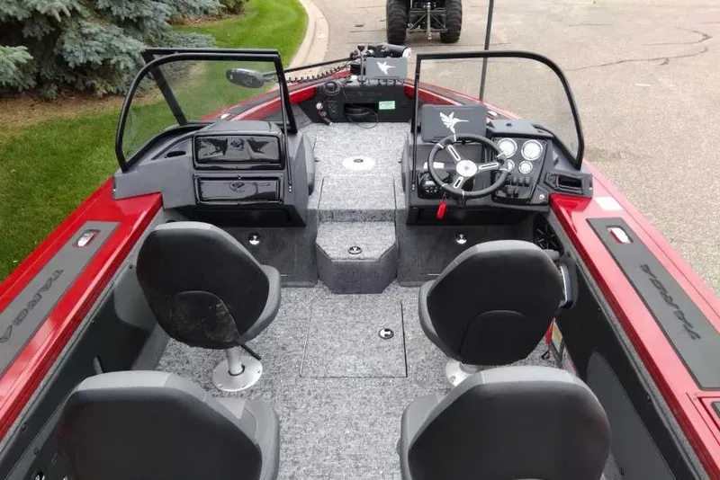 Slide: The Image of 2026 Tracker Targa V-19 Combo boat interior with seating and control panel. - 6