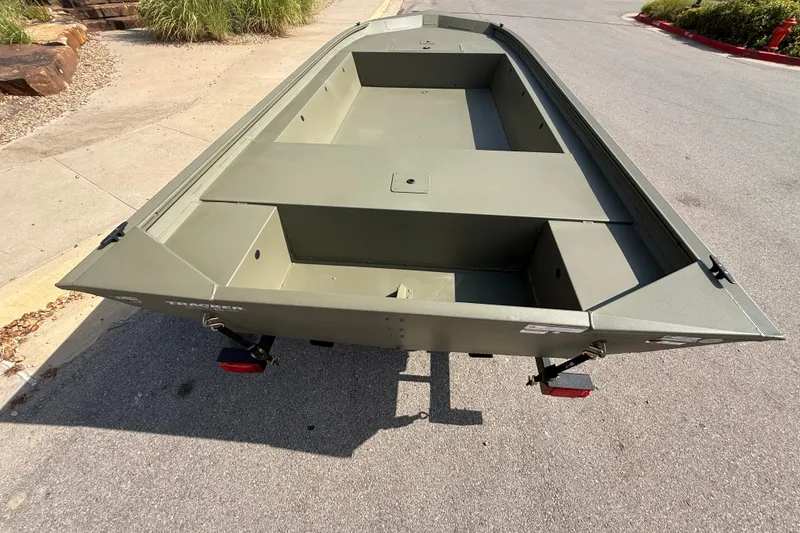 Slide: The Image of 2026 Tracker Grizzly 1754 Utility boat on trailer, parked on a street. - 7