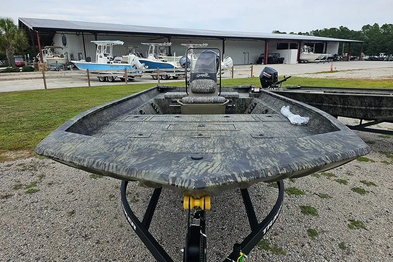 Slide: The Image of 2026 Tracker Grizzly 2072 CC boat with camouflage design on a trailer. - 4