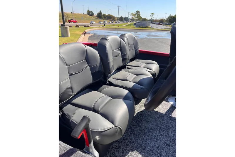 Slide: The Image of 2026 Tracker Pro Team 175 Crappie Edition boat seats, black leather, outdoor setting. - 7