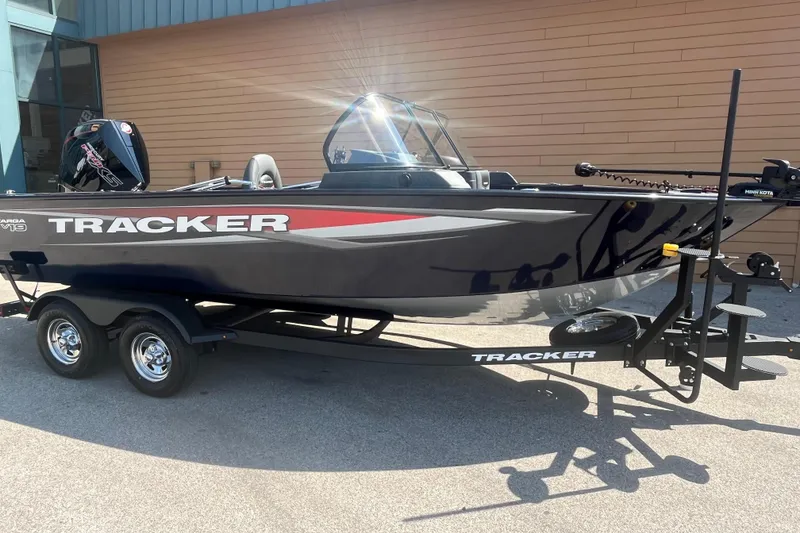 The Image of 2026 Tracker Targa V-19 Combo boat on trailer, parked outdoors. - 0