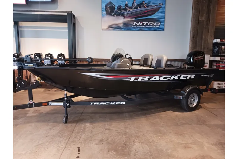 The Image of 2026 Tracker Super Guide V-16 SC fishing boat on display in showroom. - 0