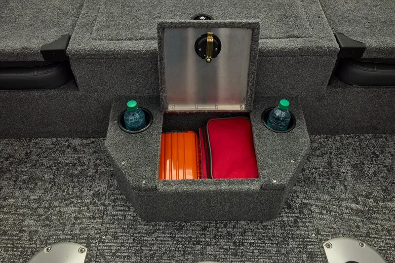 Slide: The Image of 2026 Tracker Targa V-19 Combo boat storage compartment with cup holders and gear. - 41