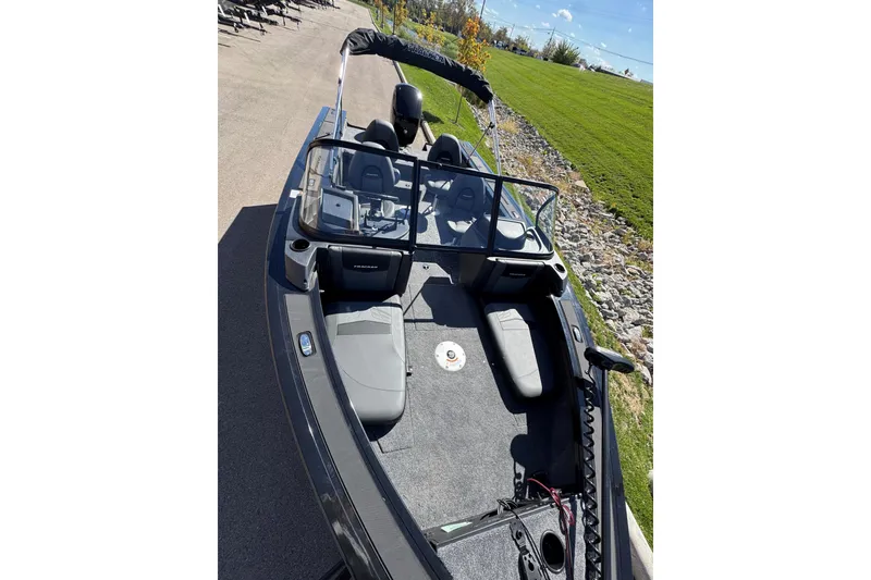 Slide: The Image of 2026 Tracker Targa V-19 Combo boat on trailer, side view, beige color. - 2