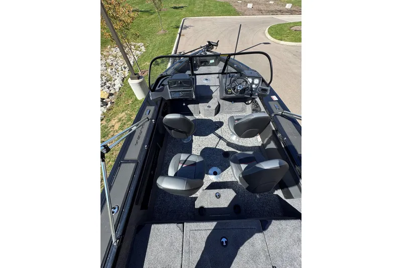 Slide: The Image of 2026 Tracker Targa V-19 Combo boat interior with seating and steering console. - 3