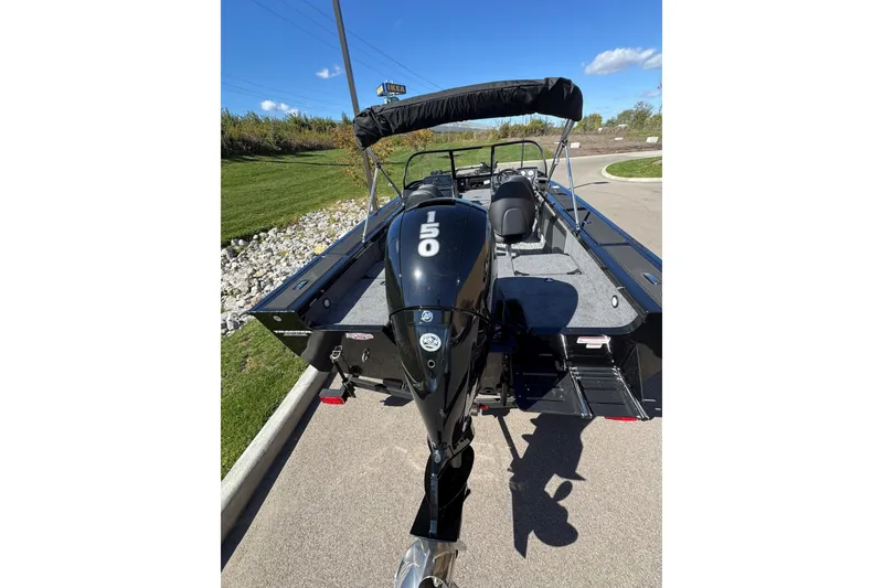 Slide: The Image of 2026 Tracker Targa V-19 Combo boat with 150 HP engine, parked on a sunny day. - 4