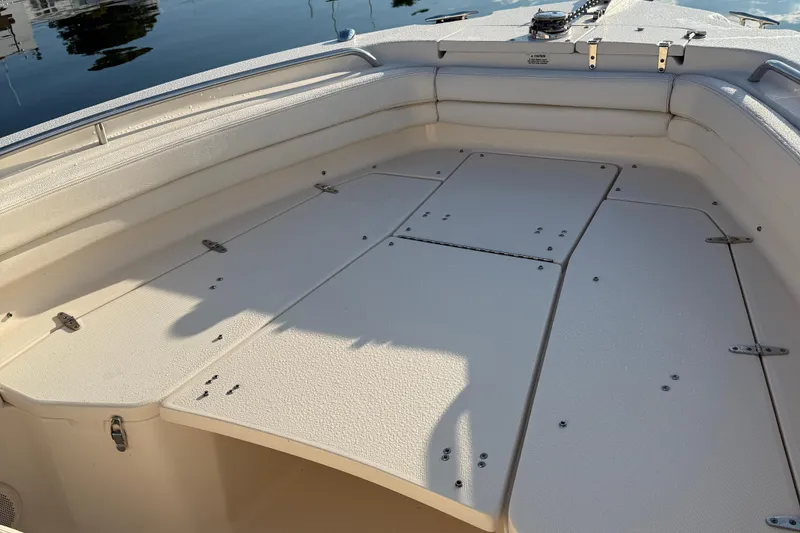 Slide: The Image of 2017 Grady White 257 Fisherman boat interior with spacious seating and storage compartments. - 12