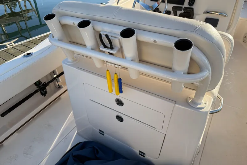 Slide: The Image of 2017 Grady White 257 Fisherman boat interior with rod holders and storage compartments. - 14