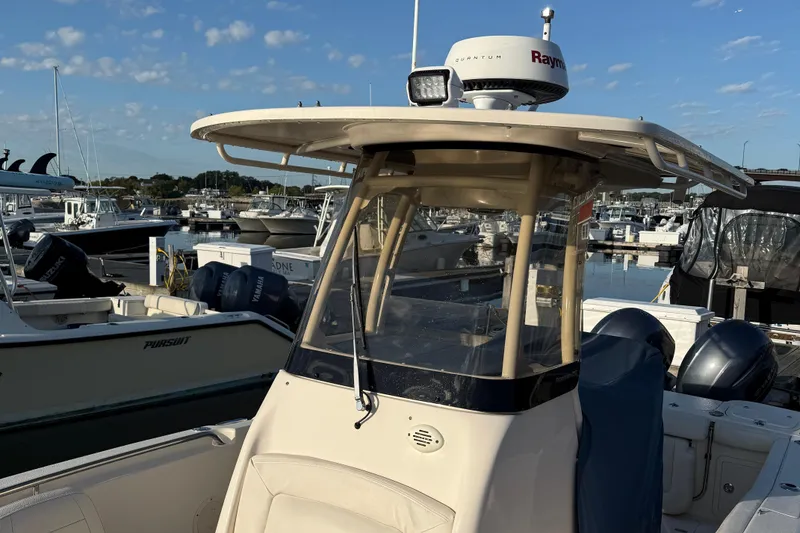 Slide: The Image of 2017 Grady White 257 Fisherman boat docked at marina under clear sky. - 7