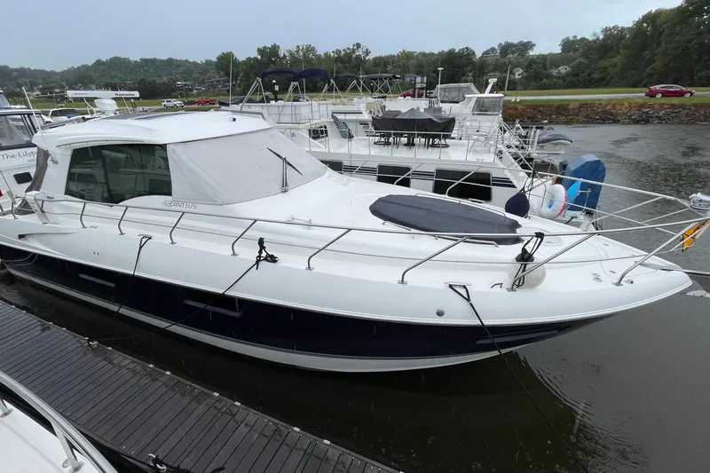 Slide: The Image of 2012 Cruisers Yachts 48 Cantius docked at marina, side view. - 10