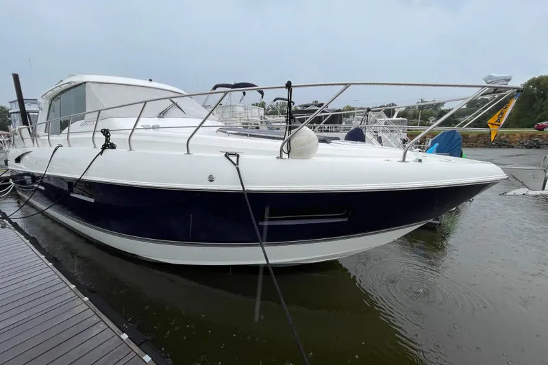 Slide: The Image of 2012 Cruisers Yachts 48 Cantius docked, showcasing sleek design and modern features. - 11