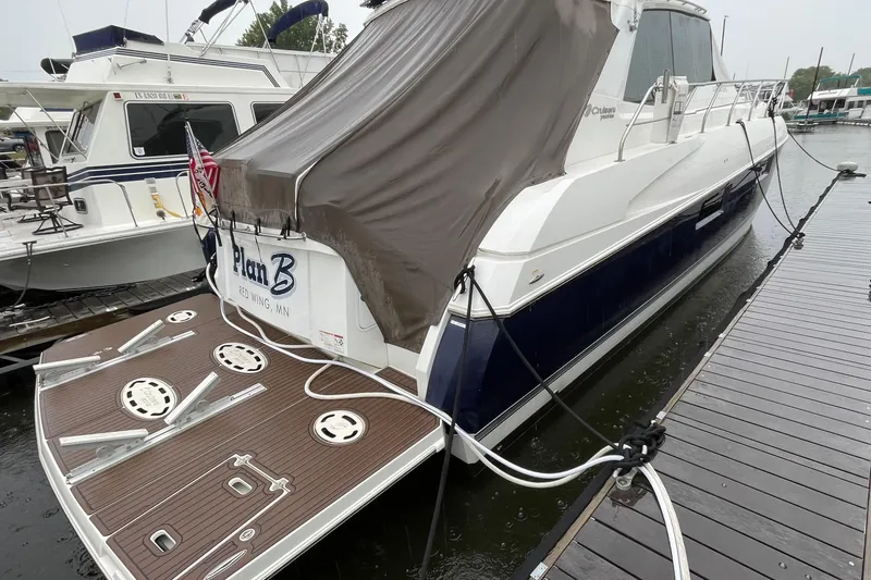 Slide: The Image of 2012 Cruisers Yachts 48 Cantius docked, rear view with covered deck, Red Wing, MN. - 13