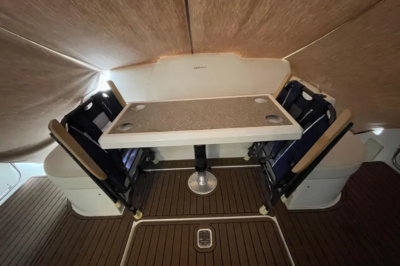 Slide: The Image of Interior of 2012 Cruisers Yachts 48 Cantius with table and seating area. - 14
