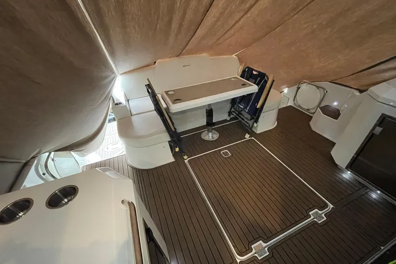 Slide: The Image of Interior of 2012 Cruisers Yachts 48 Cantius with seating and table on wooden deck. - 15