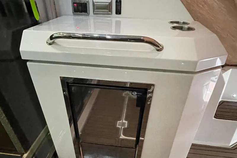 Slide: The Image of 2012 Cruisers Yachts 48 Cantius docked, rear view with "Plan B" name and American flag. - 18