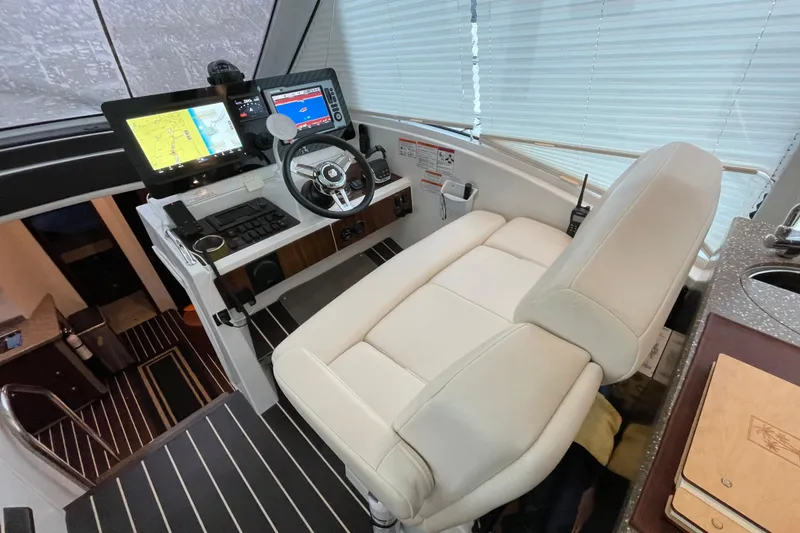 Slide: The Image of 2012 Cruisers Yachts 48 Cantius deck with sliding glass doors and scenic water view. - 21