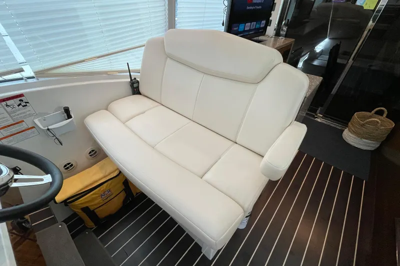 Slide: The Image of 2012 Cruisers Yachts 48 Cantius outdoor kitchenette with mini fridge and cup holders. - 22