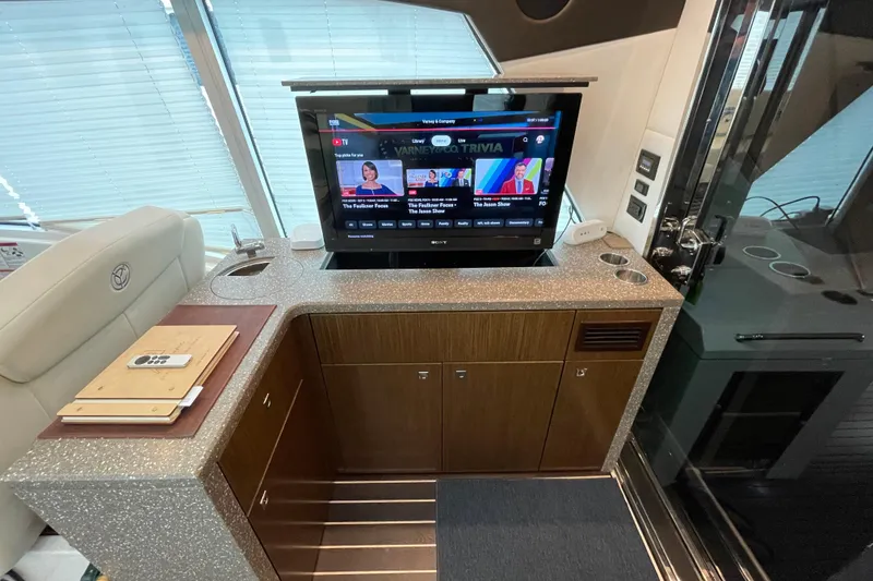 Slide: The Image of Luxurious interior of 2012 Cruisers Yachts 48 Cantius with modern helm and seating area. - 23