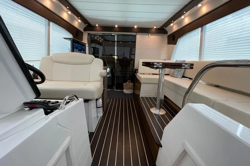 Slide: The Image of Luxurious interior of 2012 Cruisers Yachts 48 Cantius with elegant seating and table. - 24