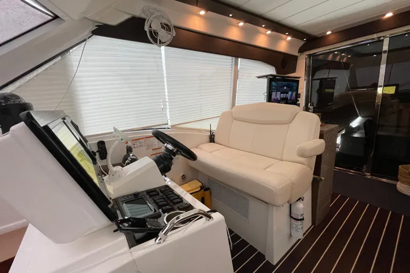 Slide: The Image of Luxurious white seating in 2012 Cruisers Yachts 48 Cantius interior, featuring modern design. - 26