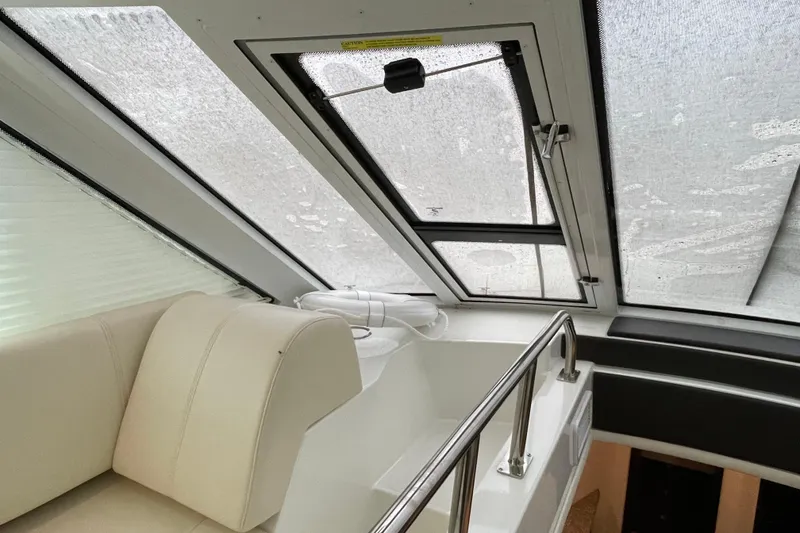 Slide: The Image of 2012 Cruisers Yachts 48 Cantius interior with TV and control panel. - 27